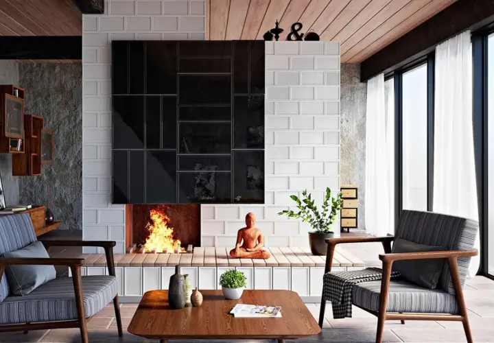 Moderne Kamin Ideen Wohnzimmer: Ein gemütliches Wohnzimmer mit Kamin, der mit schwarzen und weißen Fliesen verkleidet ist. Ein Buddha sitzt vor dem Kamin.