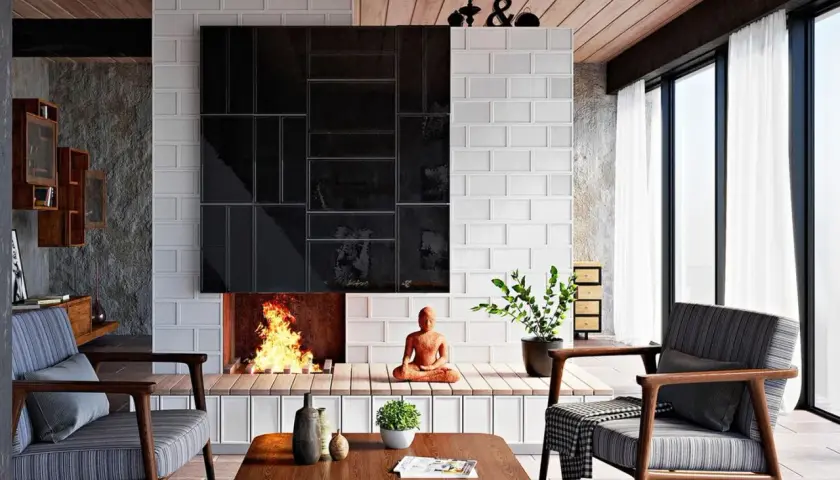 Moderne Kamin Ideen Wohnzimmer: Ein gemütliches Wohnzimmer mit Kamin, der mit schwarzen und weißen Fliesen verkleidet ist. Ein Buddha sitzt vor dem Kamin.