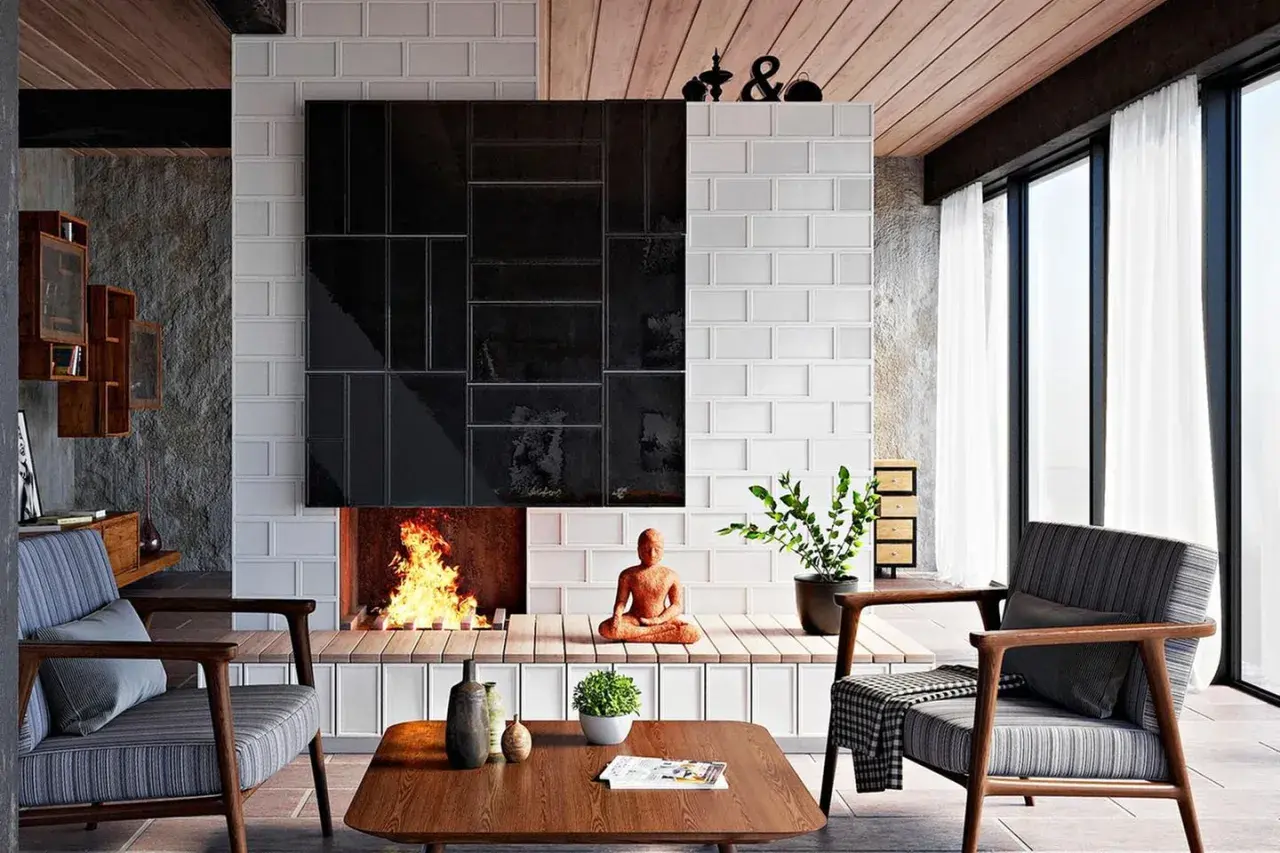 Moderne Kamin Ideen Wohnzimmer: Ein gemütliches Wohnzimmer mit Kamin, der mit schwarzen und weißen Fliesen verkleidet ist. Ein Buddha sitzt vor dem Kamin.